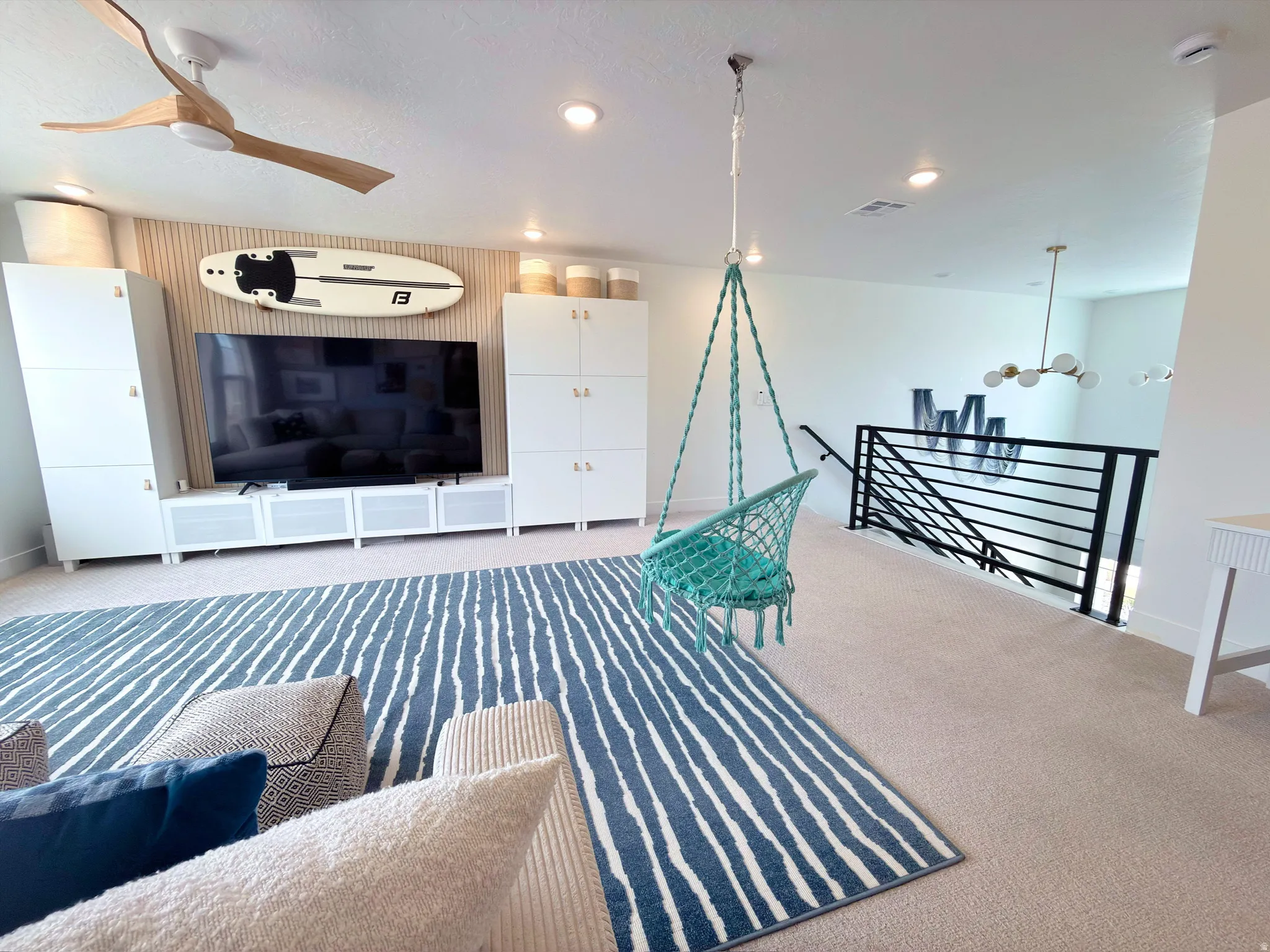 Carpeted loft space featuring recessed lighting and a ceiling fan