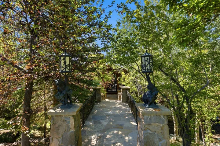 Stone pathway featuring decorative iron railings