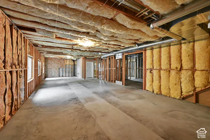 Spacious unfinished basement offering significant potential for customization