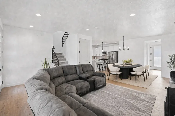 Open-concept living area with virtually staged dining area