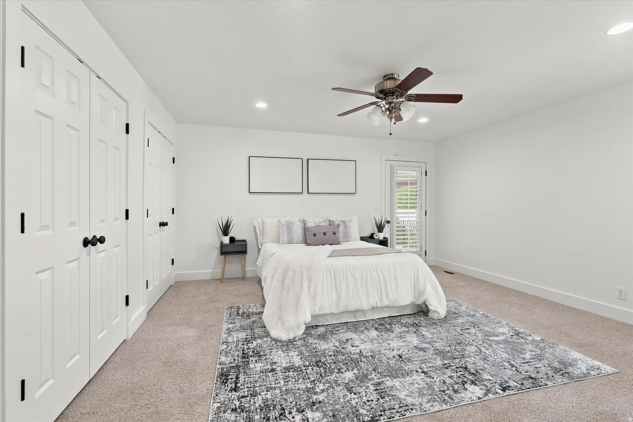 Bedroom featuring plush carpeting, recessed lighting, and a ceiling fan