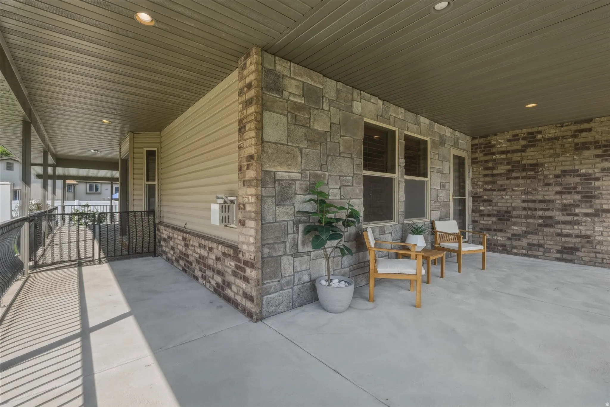Covered outdoor patio featuring a concrete surface