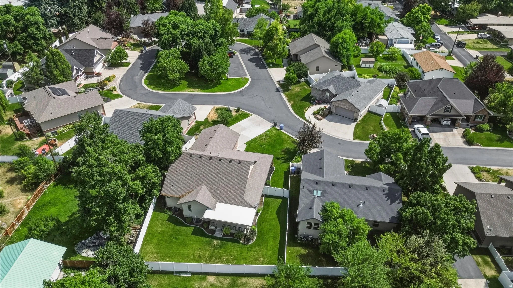 Residential neighborhood featuring established homes with various rooflines and mature landscaping