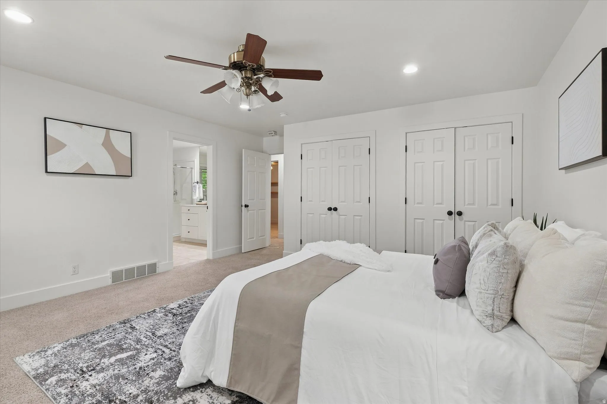 Carpeted room with white walls, recessed lighting, and a ceiling fan with light fixture