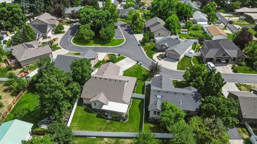 Residential neighborhood featuring established homes with various rooflines and mature landscaping