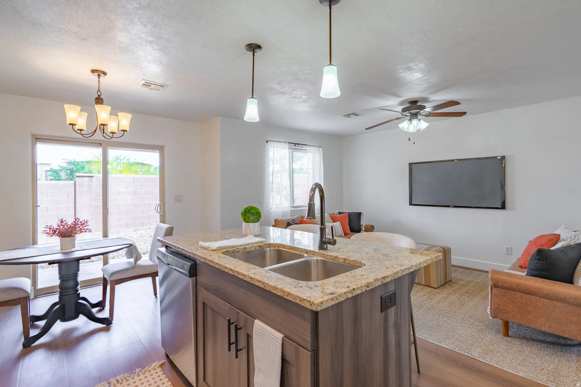 Kitchen island with dual stainless steel sink and granite-style countertop