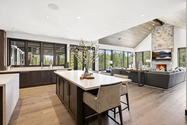Open-concept living space with light wood-finish flooring