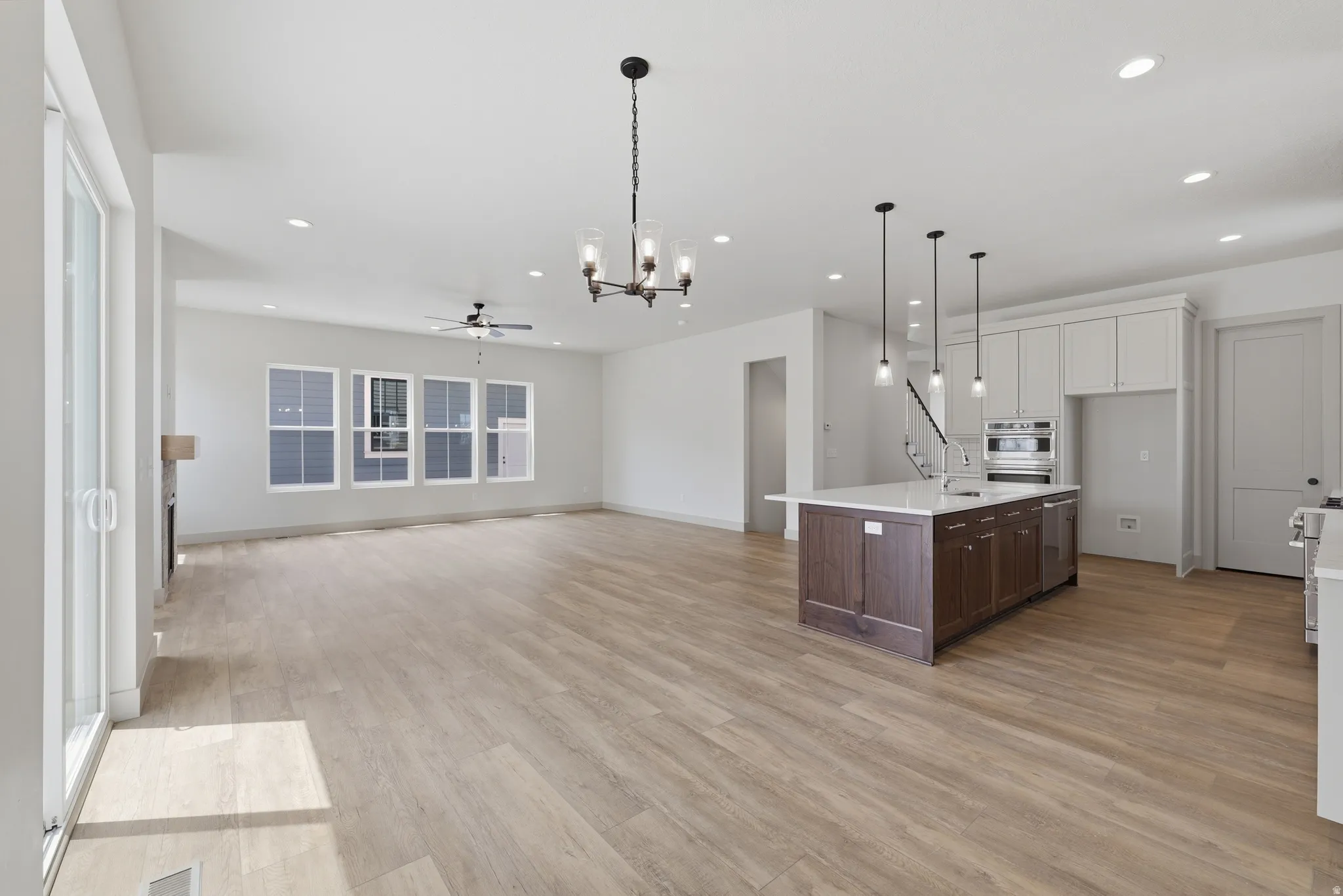 Open-concept interior featuring wood-finish flooring throughout