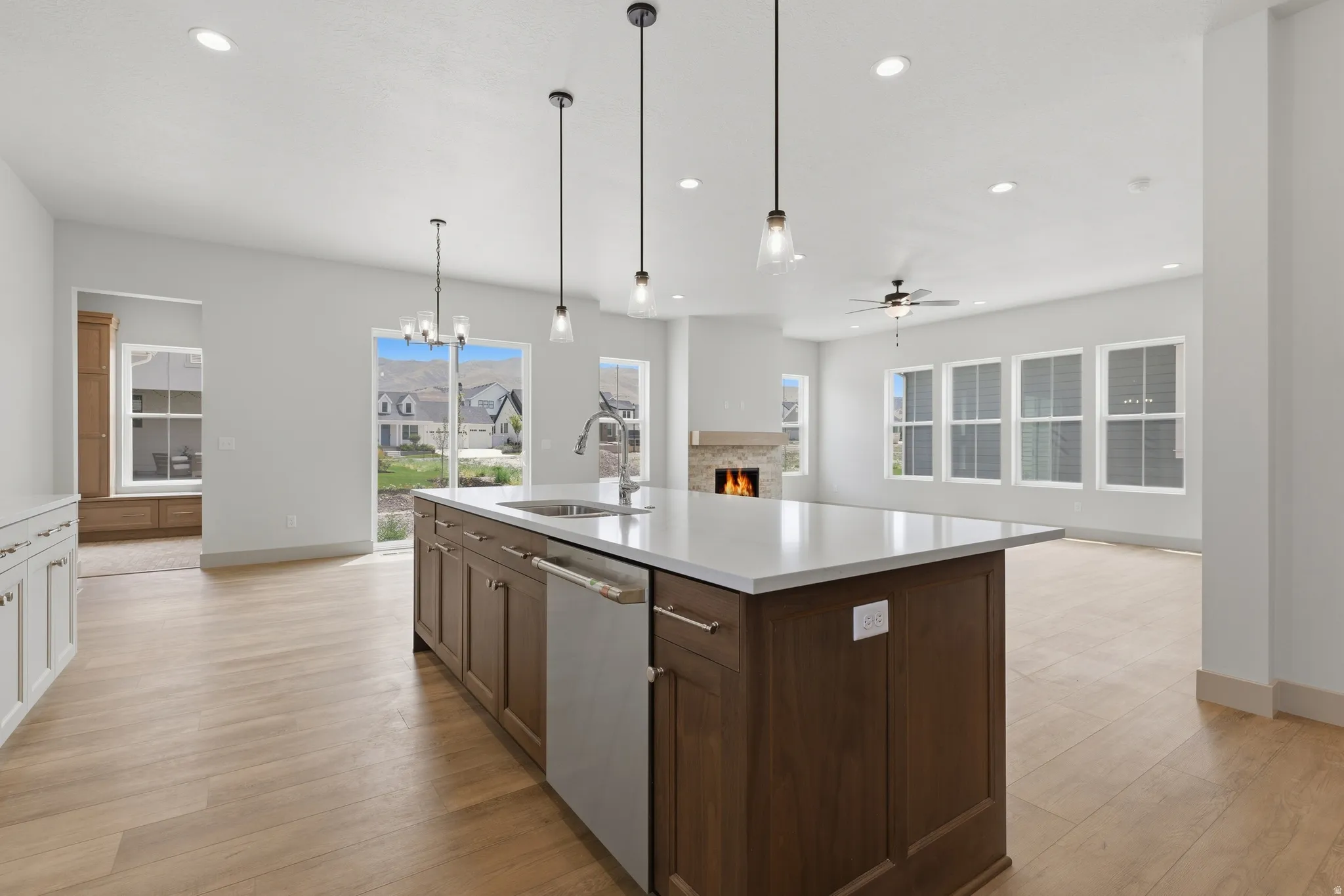 Central kitchen island with a built-in sink and stainless steel dishwasher