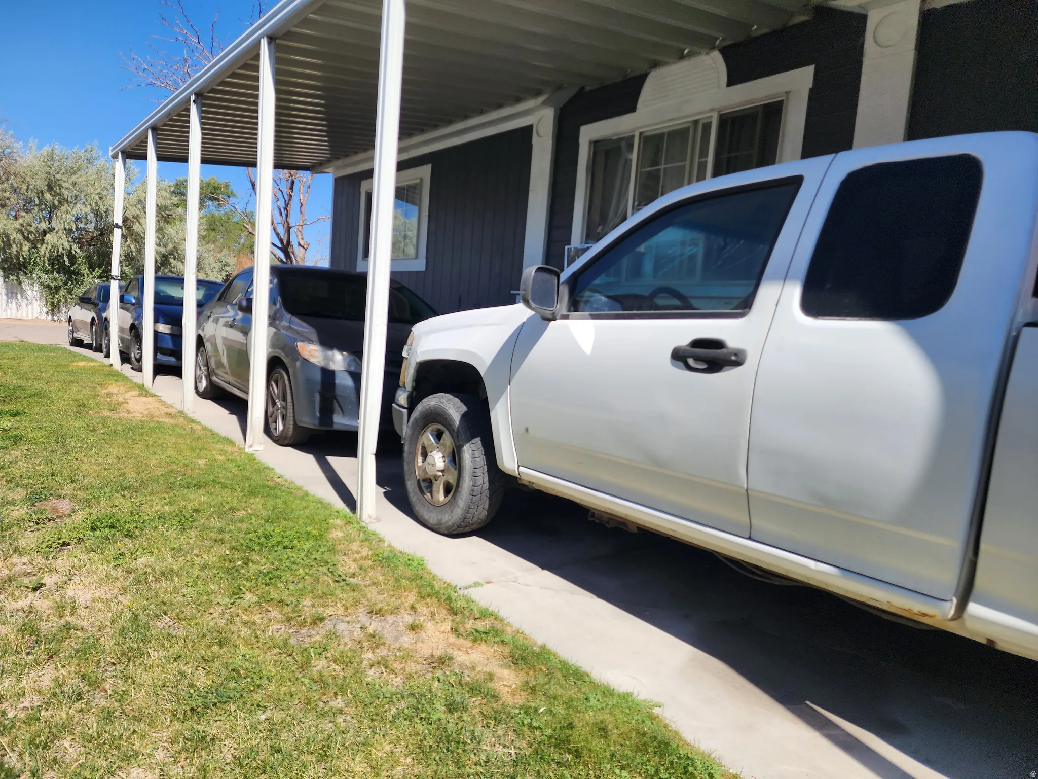 Covered carport providing sheltered parking