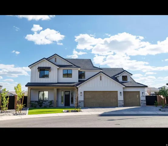Contemporary exterior featuring a black tiled roof, board and batten siding, stucco finishes, stone accents, and two wood-finish garage doors