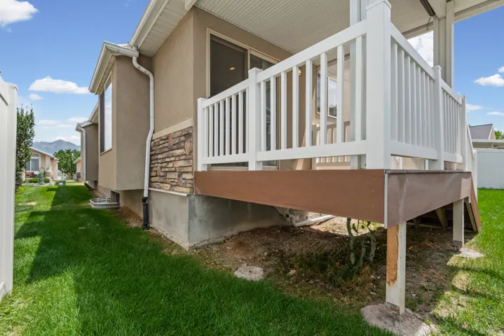 Backyard featuring covered deck off kitchen and dining