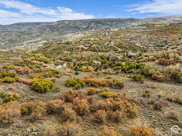Expansive mountain landscape with varied terrain and established residences