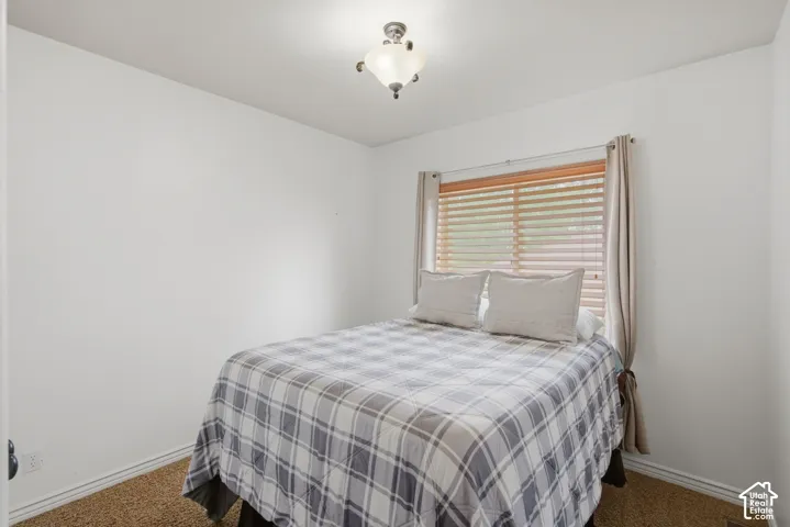Interior room featuring neutral wall finishes and textured carpeting
