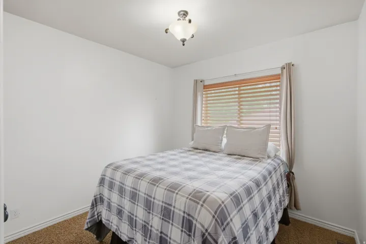 Interior room featuring neutral wall finishes and textured carpeting