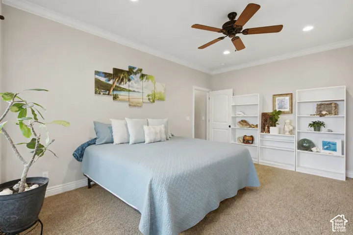 Recessed lighting and a ceiling fan fixture complement the room's neutral wall tones
