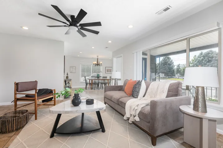 Open concept living area featuring recessed lighting, a modern ceiling fan, and light-colored walls