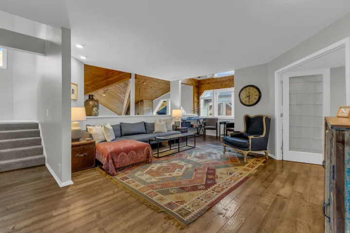 Family Room. Stairs lead up to Primary Suite