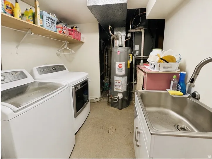 Dedicated utility space featuring a stainless steel utility sink with a gooseneck faucet, a water heater, and exposed overhead ductwork. Washer and dryer not included on sale.
