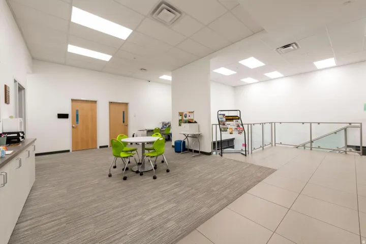 Open common area featuring recessed lighting and a drop ceiling