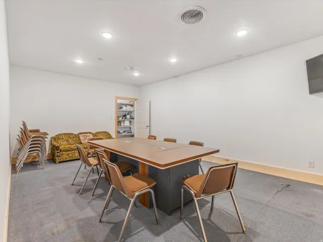 Spacious room featuring recessed lighting and a ceiling vent