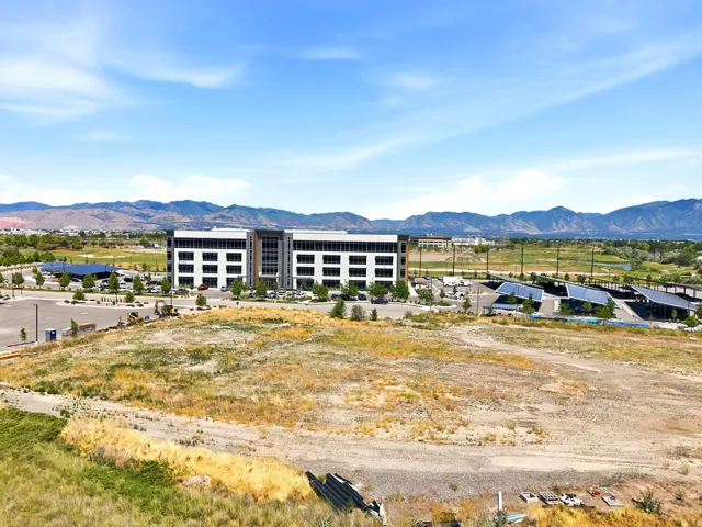 Expansive undeveloped parcel featuring distant mountain ranges and clear skies