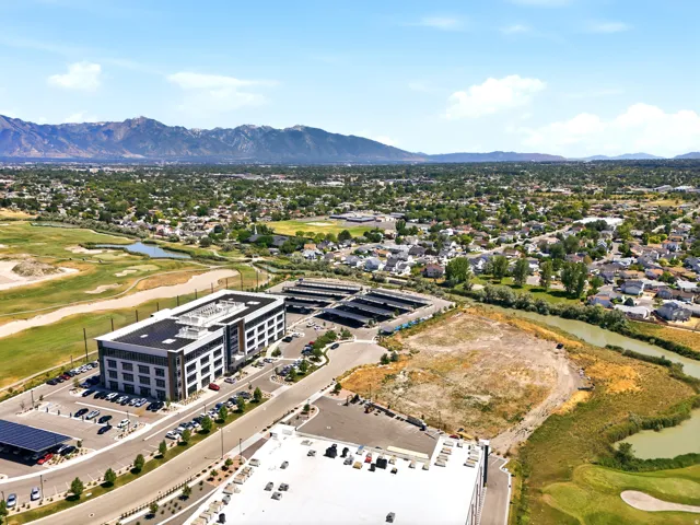 Expansive land parcel featuring direct frontage on a meandering waterway and bordering a golf course