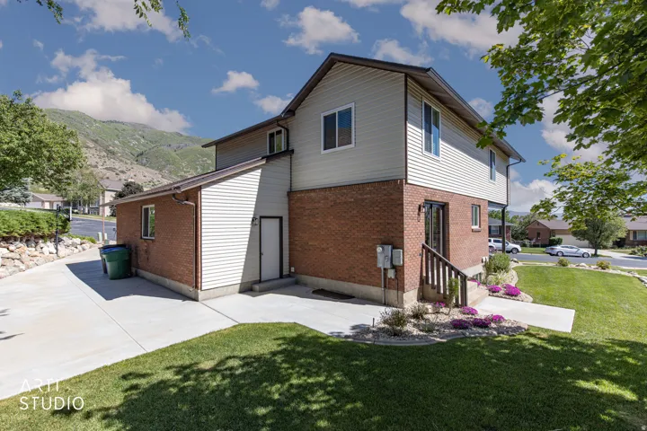 Two-story residence featuring a brick and siding exterior