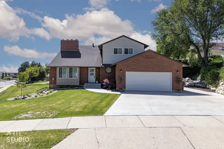 Brick and siding exterior with a two-car garage