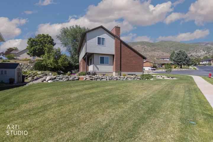 Two-story residence featuring a combination of brick and siding exteriors