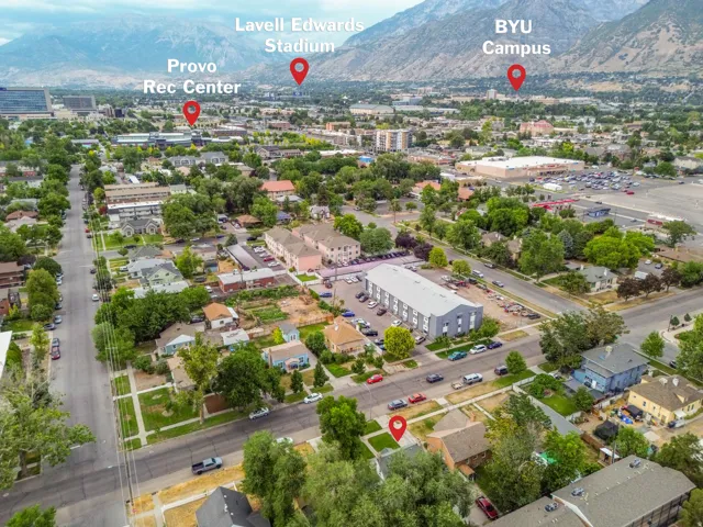 Aerial perspective showcasing a dense residential neighborhood with tree-lined streets