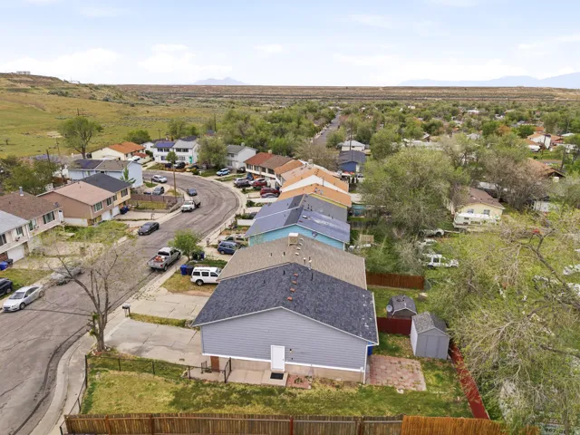 Aerial perspective showcasing a residential street with homes featuring varied exterior finishes