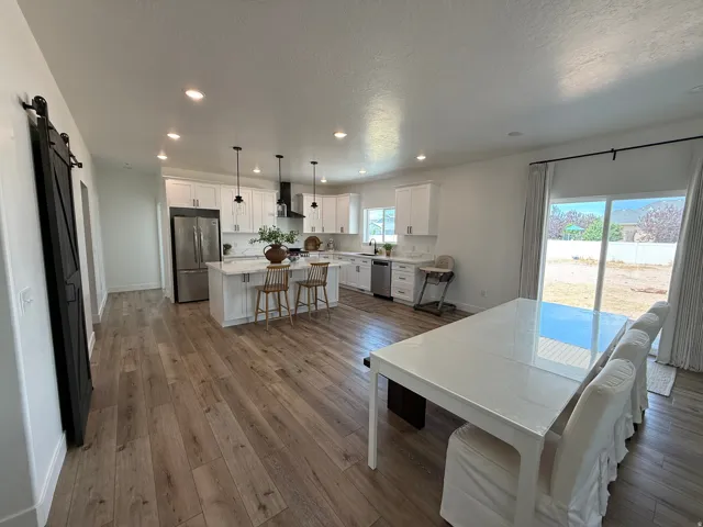 Open-concept living space featuring wood-finish flooring