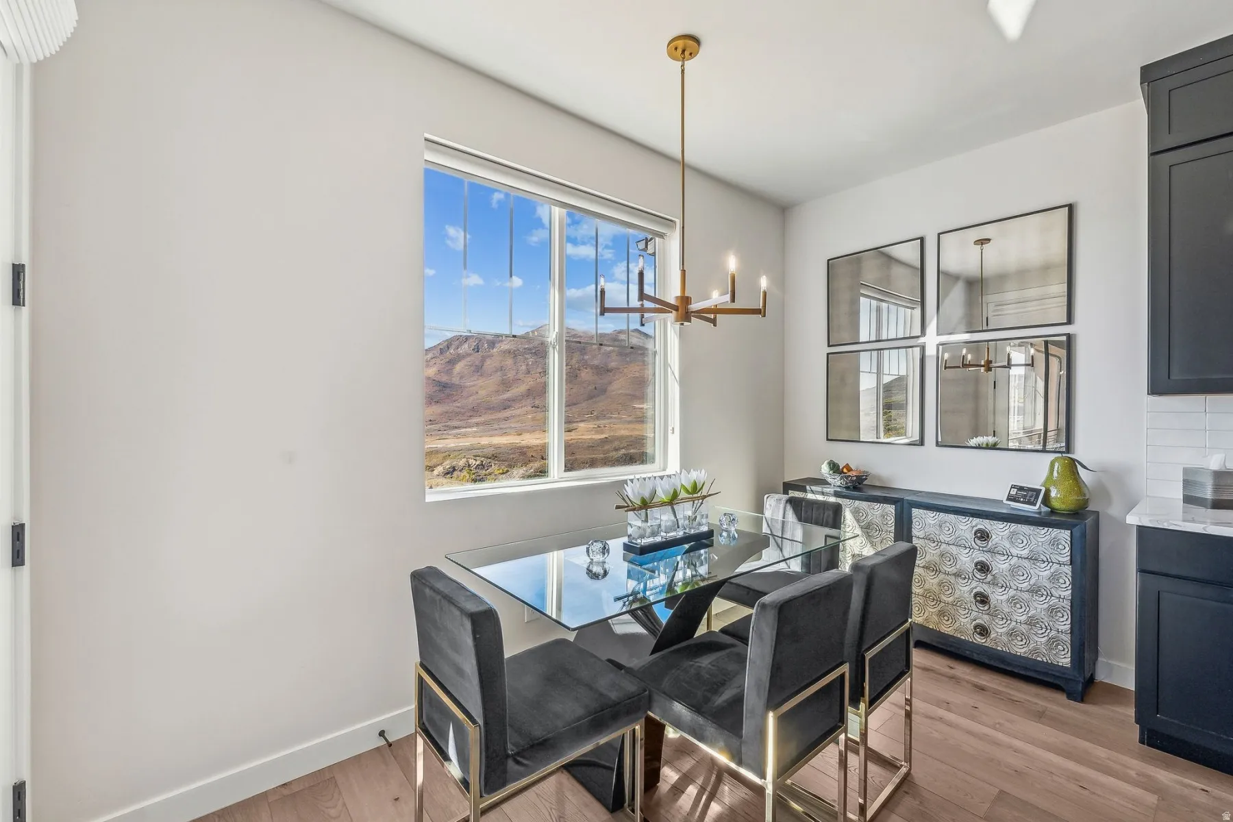 Dining area with large window framing a mountain backdrop