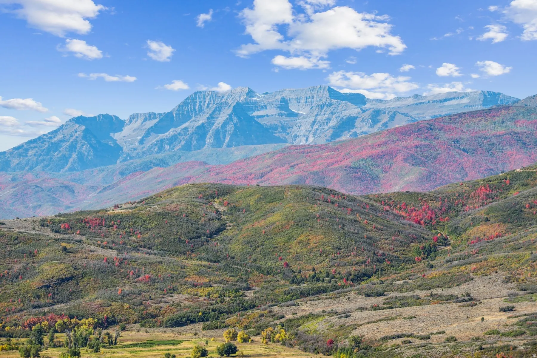 Mountain landscape featuring prominent peaks and rolling foothills