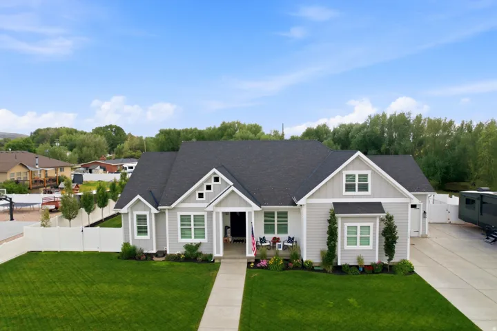 Contemporary ranch-style exterior featuring light gray siding and white trim