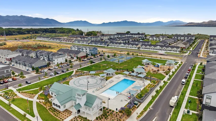 Expansive community amenities including a swimming pool, clubhouse, and tennis courts