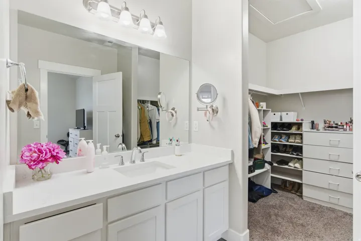 White vanity with an integrated sink and chrome fixtures