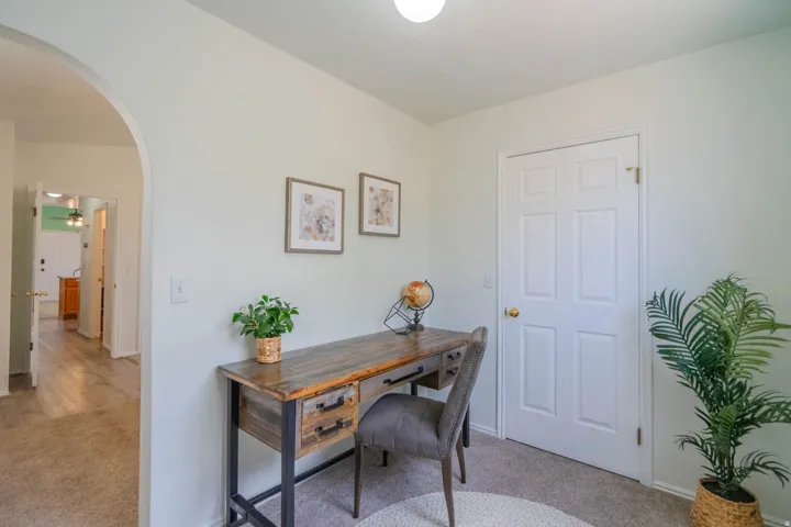 Arched entryway leading to additional rooms