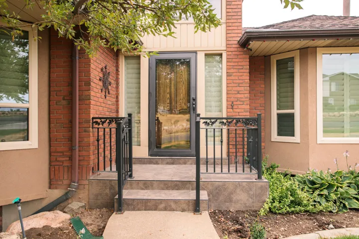 Front entry with brick and stucco exterior