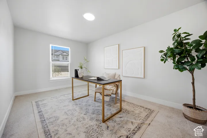 Recessed ceiling light fixture, single window with blinds, light-toned wall paint, and neutral-colored carpeting