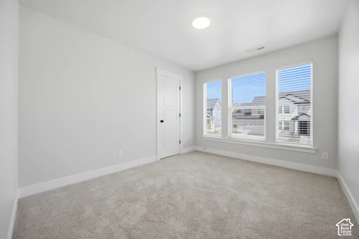 Carpeted flooring with light-colored walls