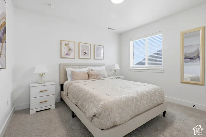 Plush carpet flooring, recessed lighting, and a window with blinds