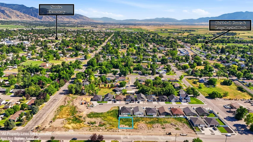 Overhead view of a developed residential area with a mountain backdrop