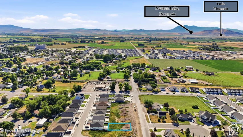 Aerial perspective showcasing a parcel of land within a developed residential area