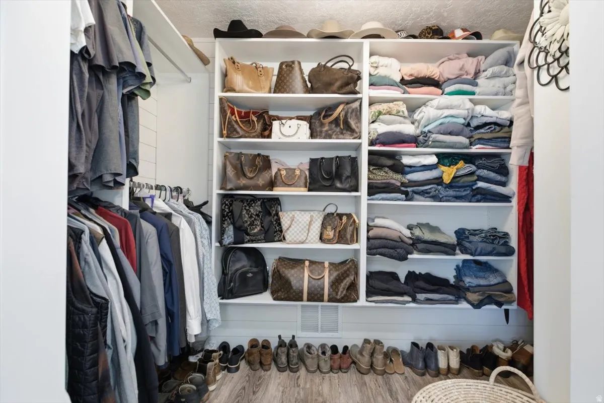 Custom-built closet system featuring extensive shelving and hanging rods