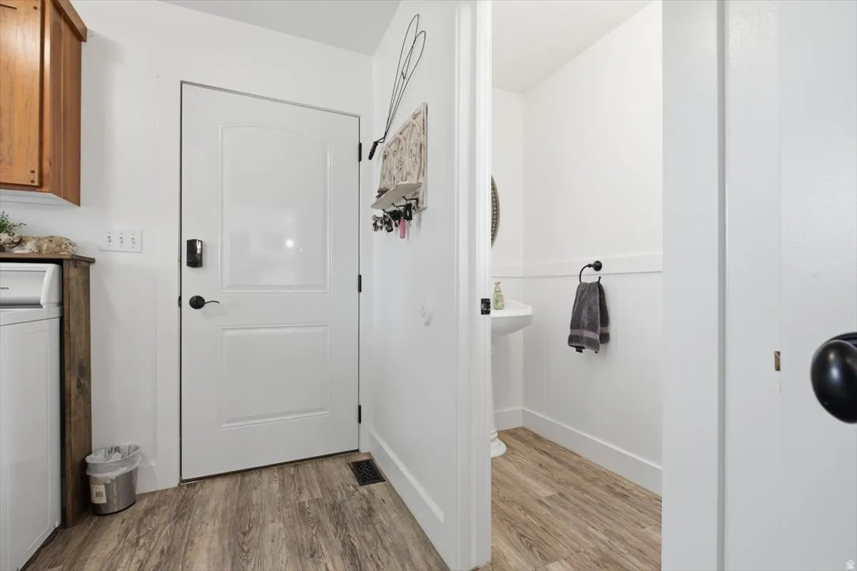 White paneled door with black hardware
