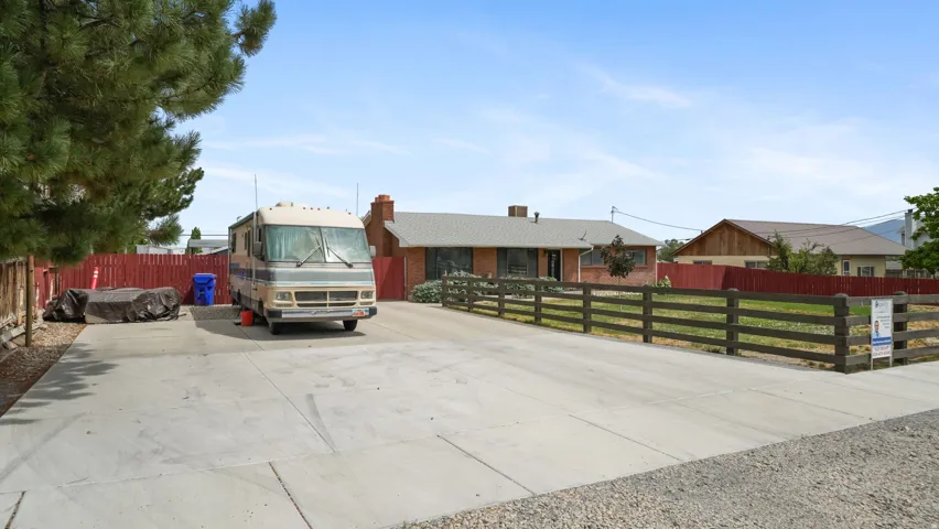 Spacious concrete driveway offering ample parking