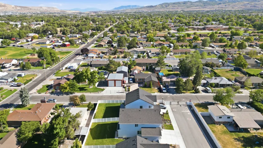 Aerial perspective of a residential community featuring established streetscapes and mature tree canopy