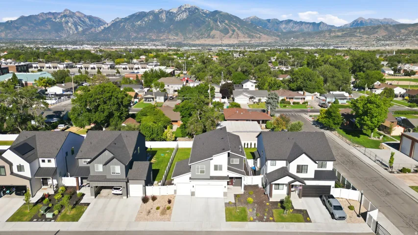 Modern residential architecture featuring a dark shingle roof and contrasting facade